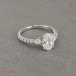 Oval CZ Three-Stone Ring in White Gold-Plated Sterling Silver - View 3