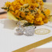 Round Moissanite Halo Stud Earrings in Platinum-Plated Sterling Silver - View 2