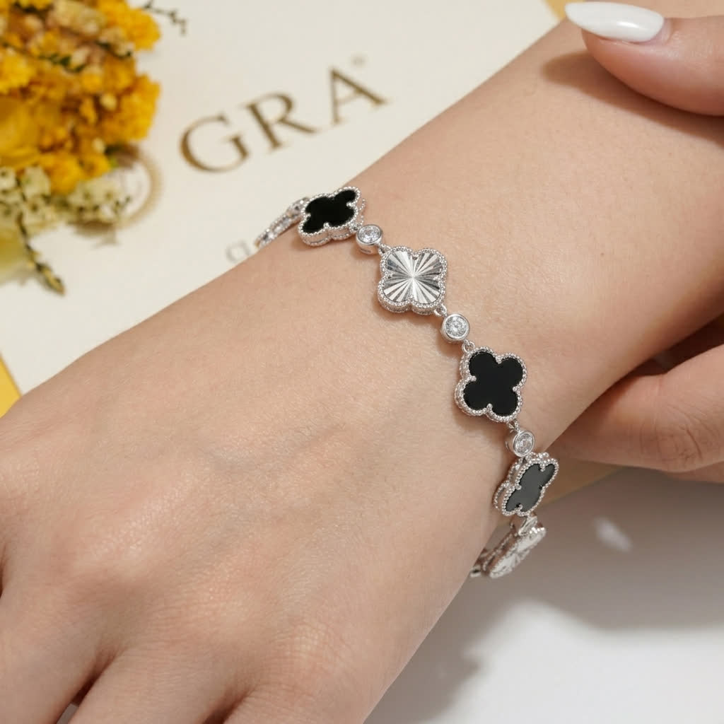 Clover and Sunburst Station Bracelet in Platinum-Plated Sterling Silver - worn view